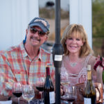 couple with wine bottles