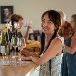 Happy lady at tasting bar